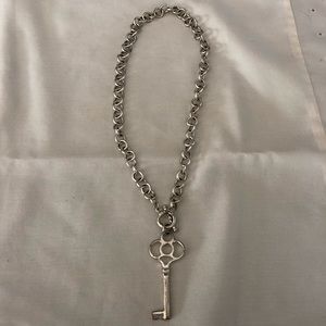 A silver key necklace